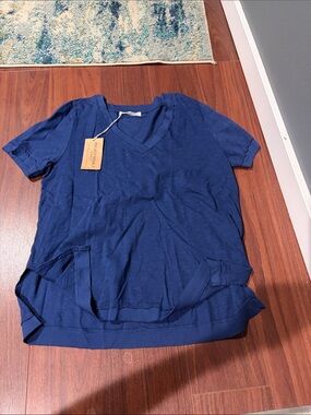 Projeck Social T: Short Sleeve Blue V-Neck Short Sleeve. Donated proceeds! Read